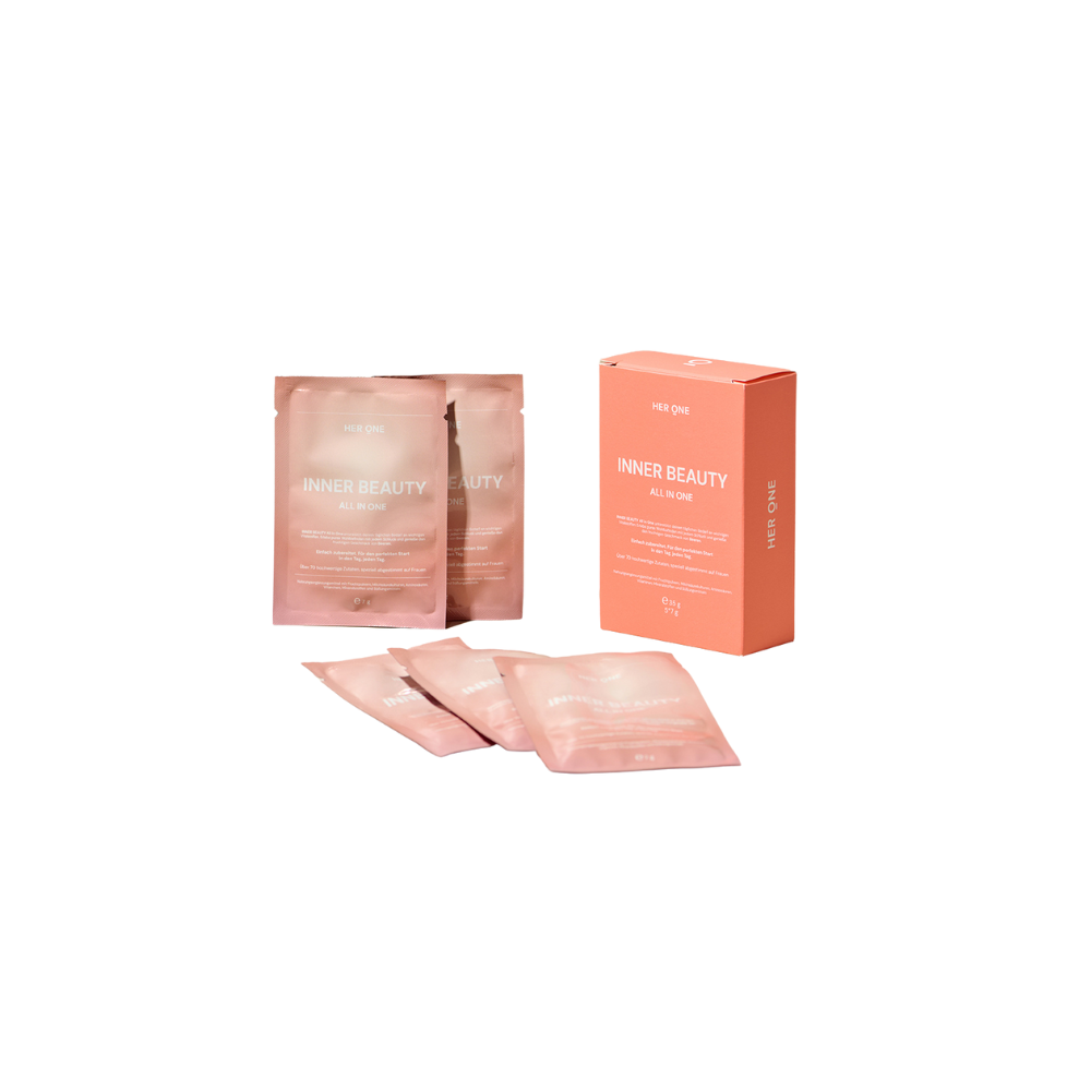 Mehrere rosa Verpackungen von "Inner Beauty All-In-One" neben einer passenden Box.