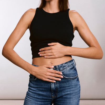 Woman supporting her digestive health