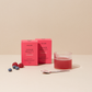 Zwei Packungen Inner Beauty All in One Mini, ein Glas mit angemischtem Inner Beauty, ein Löffel mit Pulver sowie Beeren auf der linken Seite.
