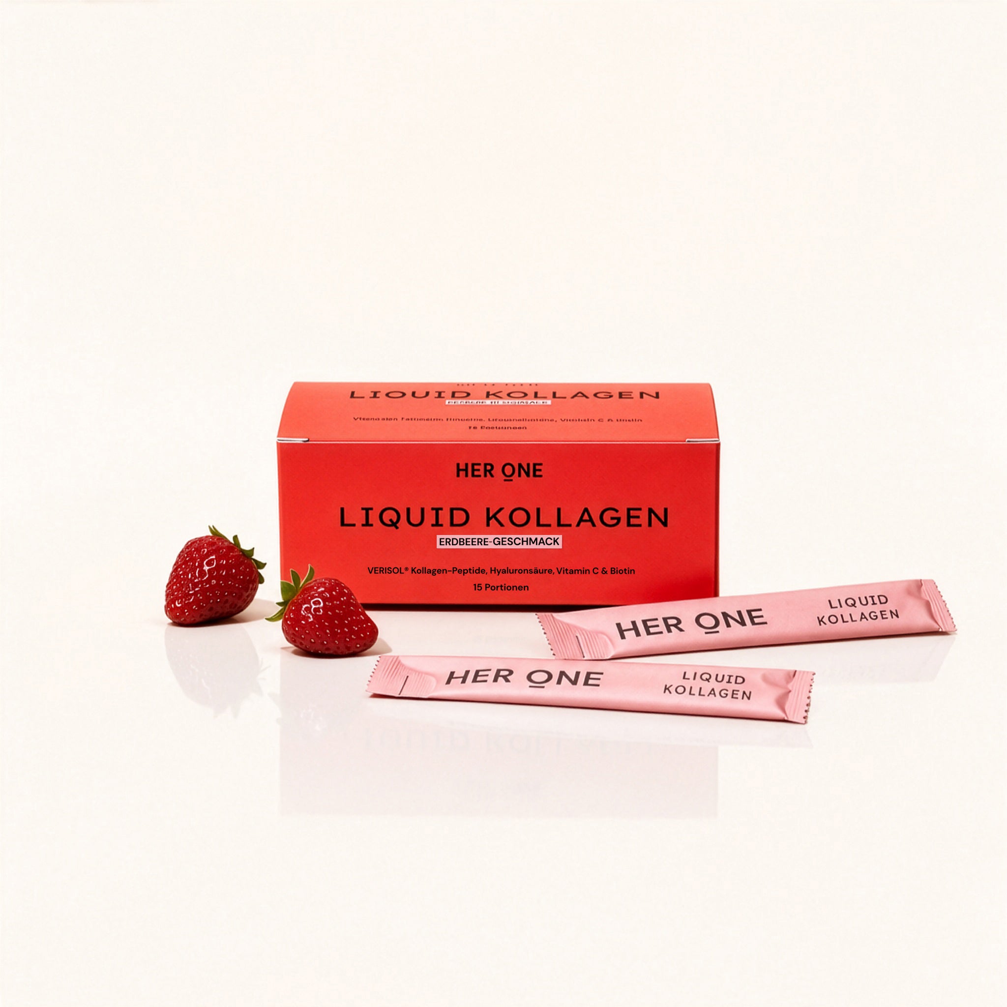 HER ONE Liquid Kollagen Box Erdbeer-Geschmack 15 Portionen mit Sticks und frischen Erdbeeren.