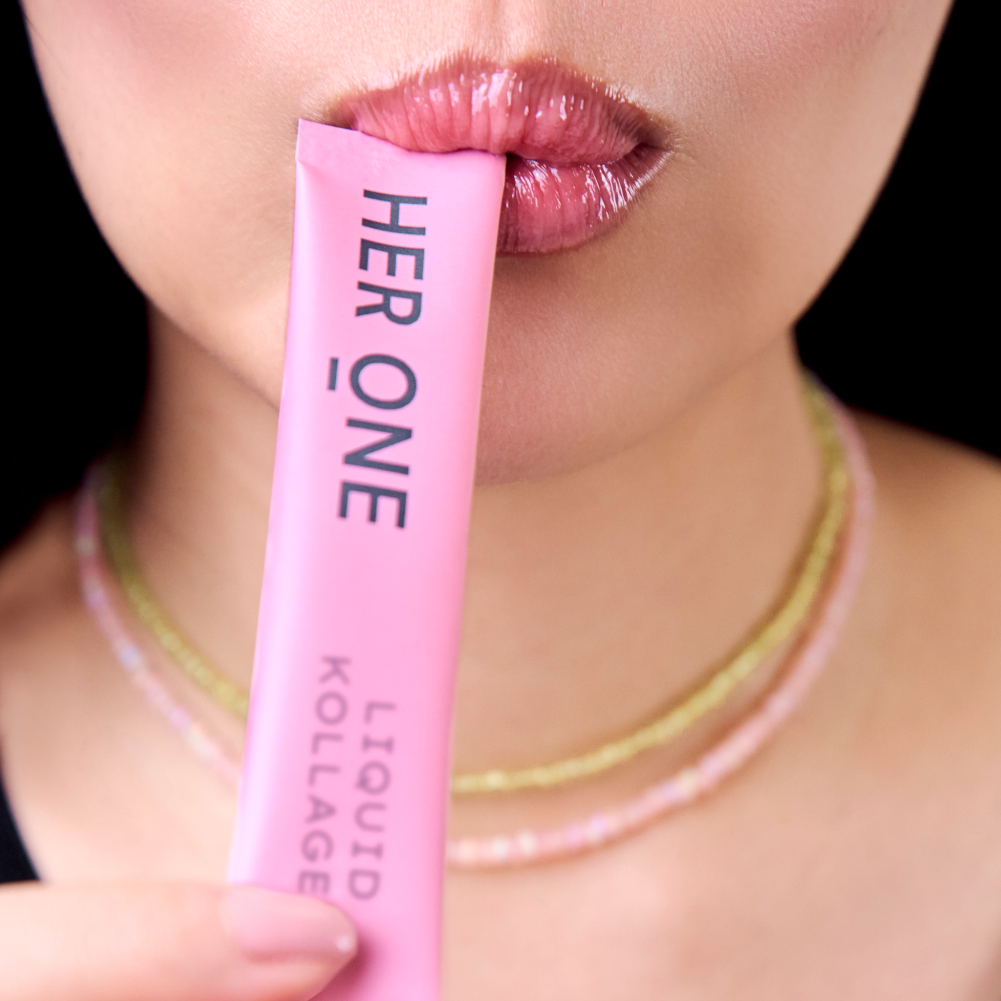 Woman drinking a LIQUID COLLAGEN stick