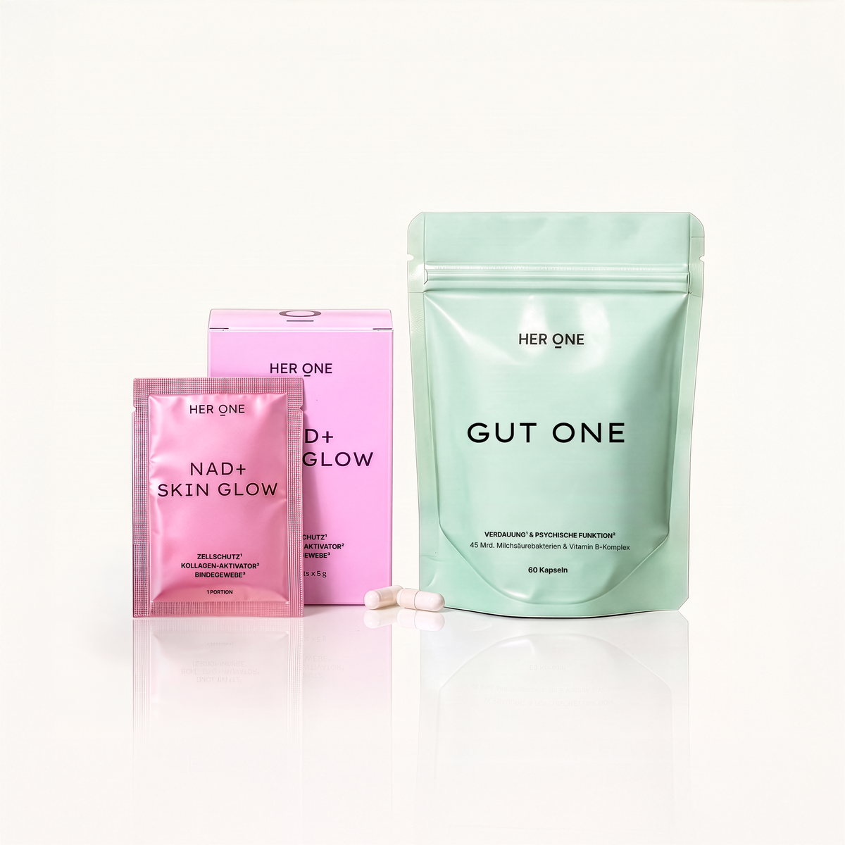 HER ONE GUT ONE Doypack und NAD+ Skin Glow Verpackung nebeneinander.