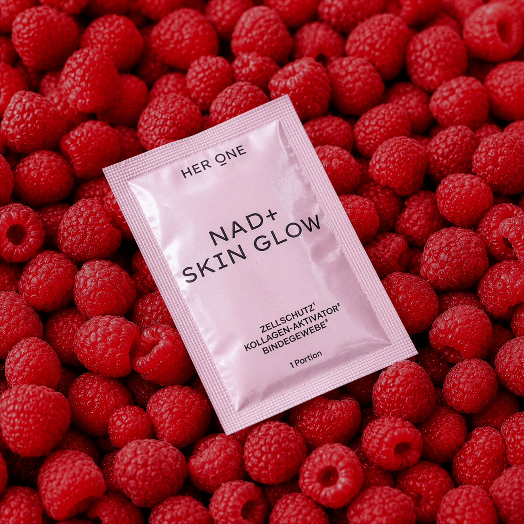 NAD+ Skin Glow on fresh red raspberries
