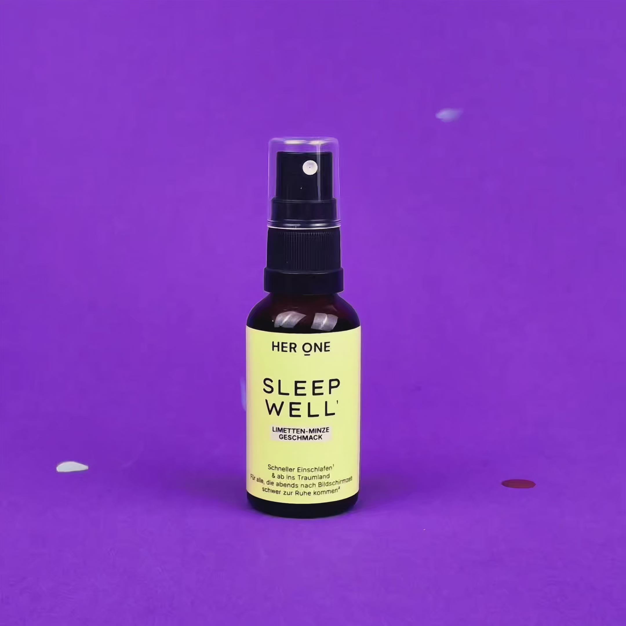 SLEEP WELL Flasche auf violettem Grund, während buntes Konfetti von oben auf das Produkt herabfällt.