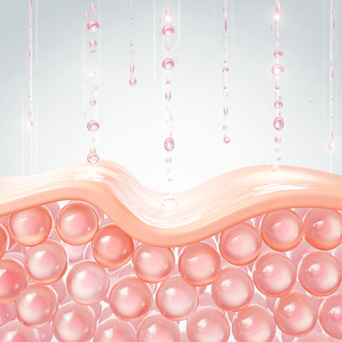 Pink balls under the skin layer with falling drops that symbolize a moisturizing effect.