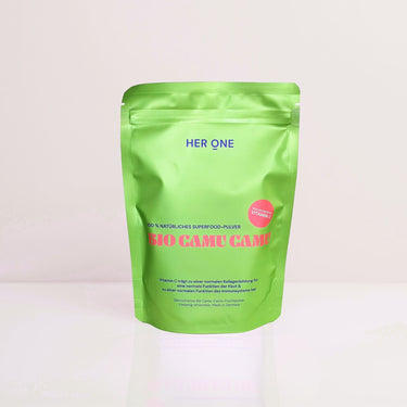 Green packaging of an organic superfood powder called "Bio Camu Camu" from "Her One" with a reference to vitamin C.
