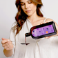 Woman pouring nutrient juice from a bottle with a purple label onto a spoon.