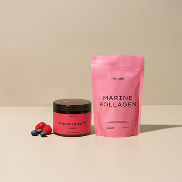 HER ONE INNER BEAUTY tin and MARINE COLLAGEN bag with berries on a beige background.