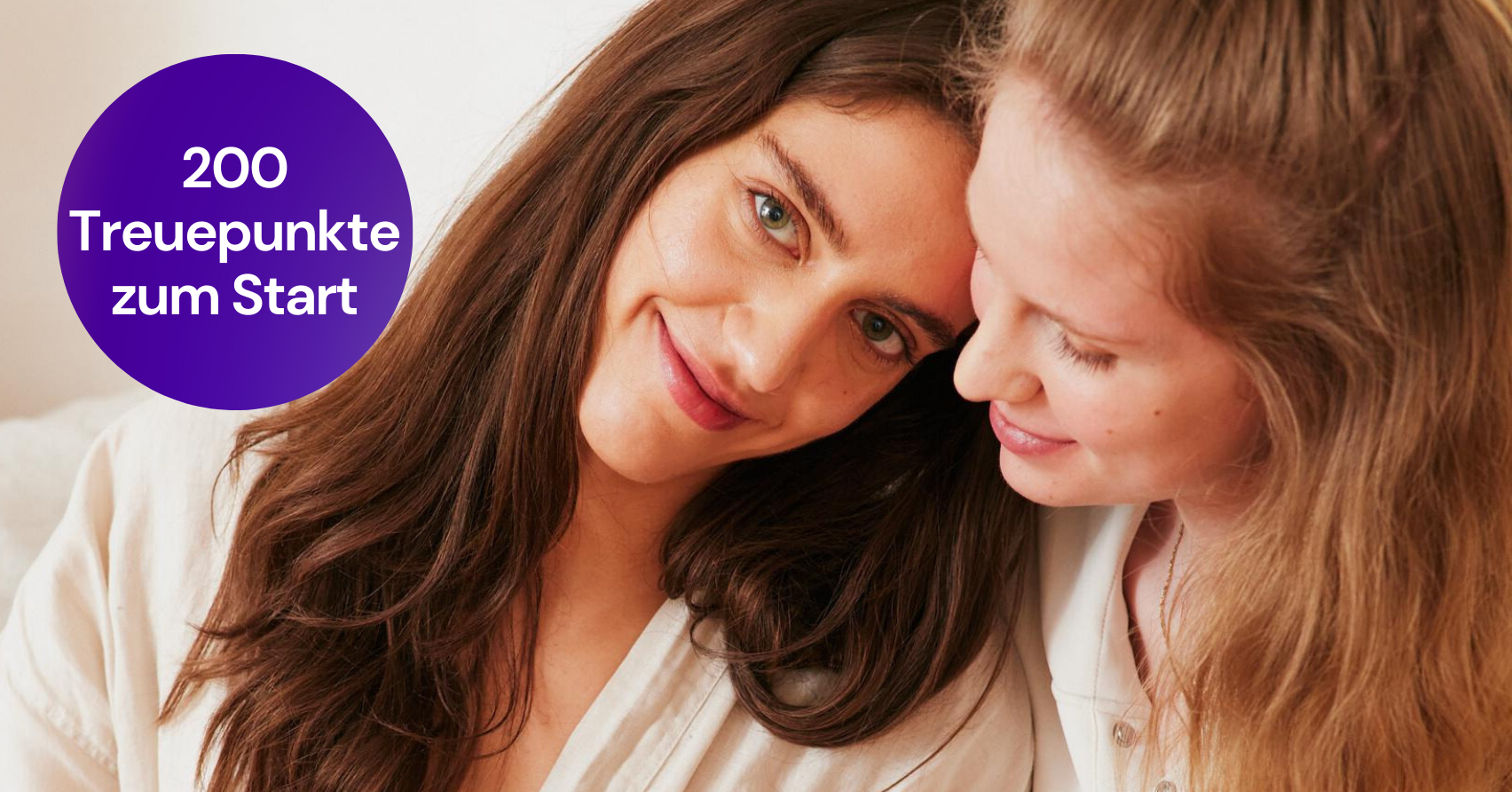 Two women smiling at each other, next to a purple circle with the text "200 loyalty points to start".
