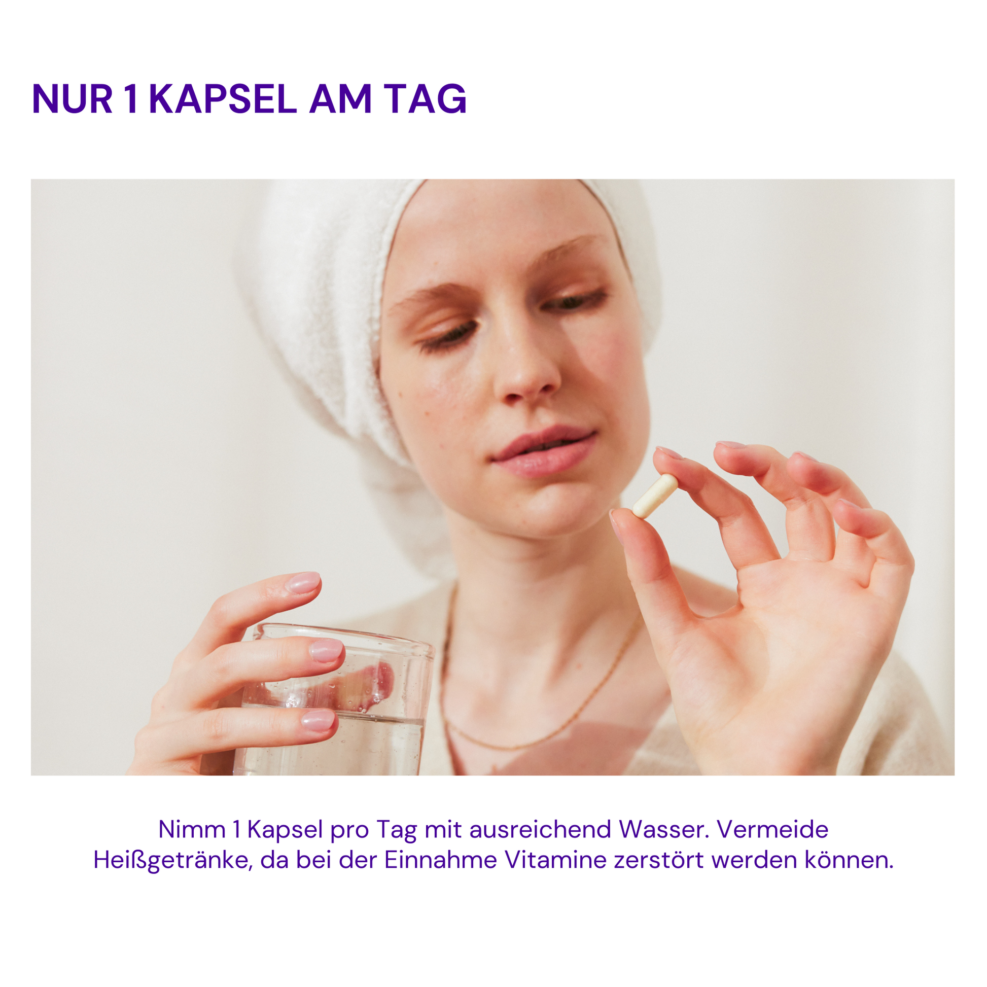 A woman with a towel on her head holds a capsule and a glass of water in her hand.