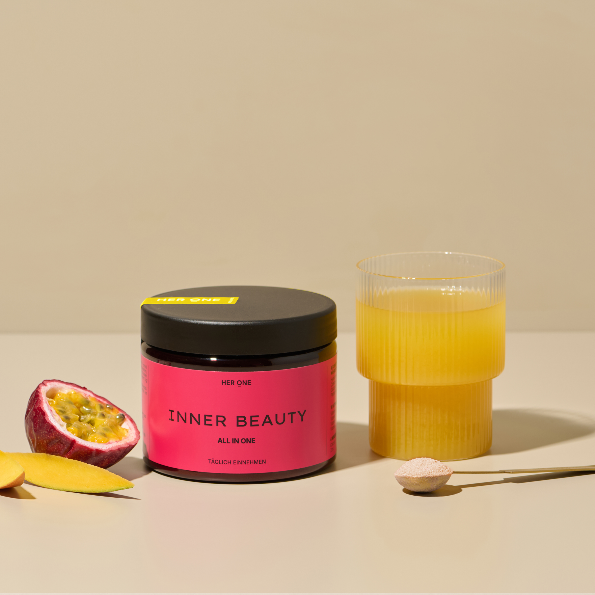 Hero Image: INNER BEAUTY powder can next to prepared drink, with passion fruit and mango.
