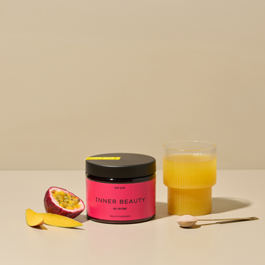 Dark red can HER ONE INNER BEAUTY mango, passion fruit, and mixed juice.