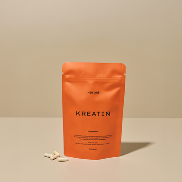 Orange bag HER ONE CREATINE capsules to boost physical performance.