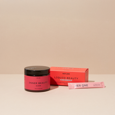Deux produits HER ONE « Liquid Beauty » et «Inner Beauty » sur fond clair.