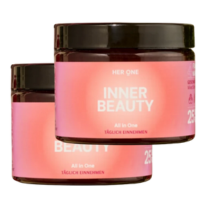 Due barattoli per cosmetici di colore rosa con la scrittaInner Beauty" e un coperchio nero.