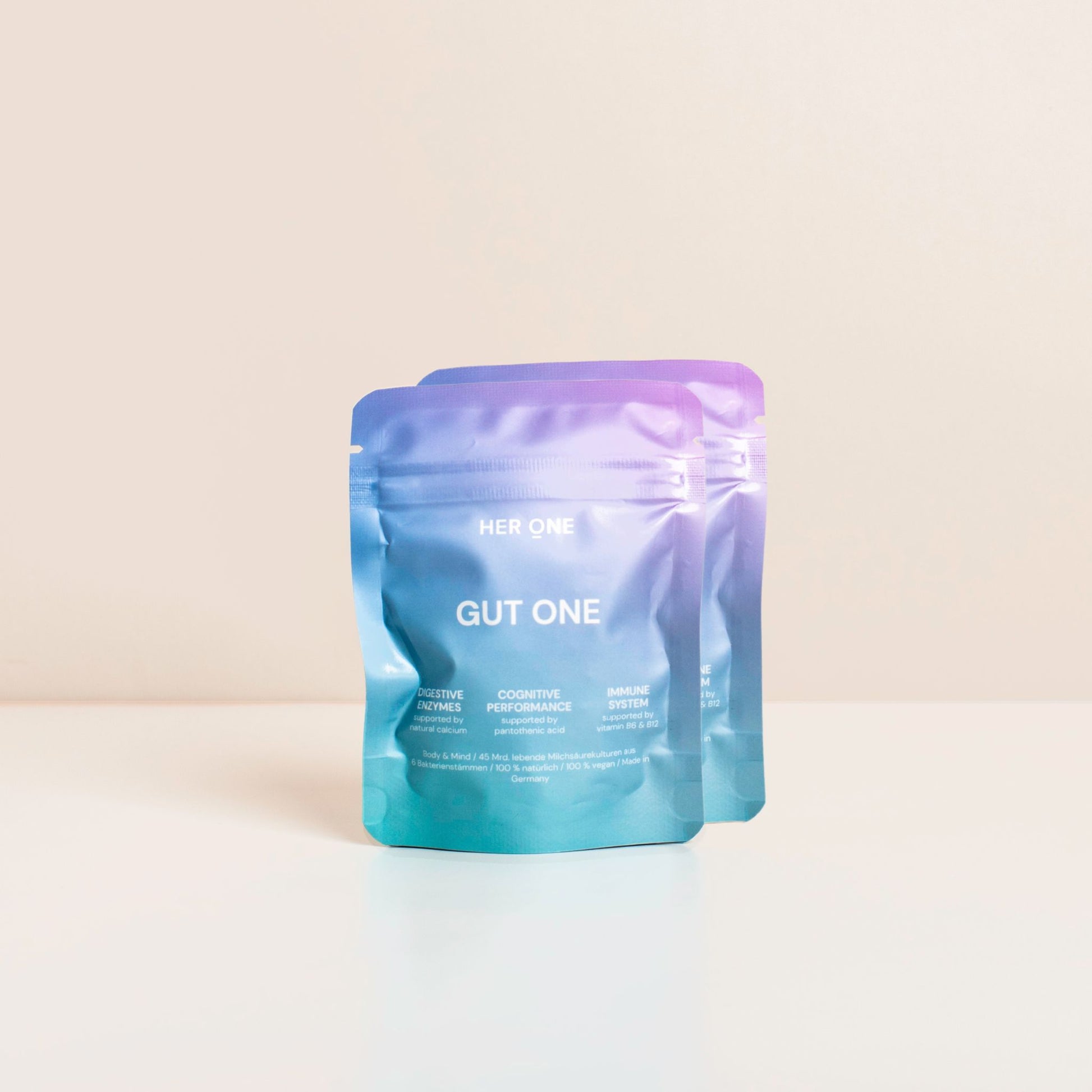Due confezioni di colore azzurro e viola con la scrittaGUT ONE" su sfondo bianco.
