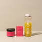HER ONE Inner Beauty Startset: blikje, doosje en shaker met gele drank, gerangschikt op een lichtgekleurde achtergrond